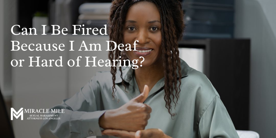 Can I Be Fired Because I Am Deaf or Hard of Hearing on top of a woman signing